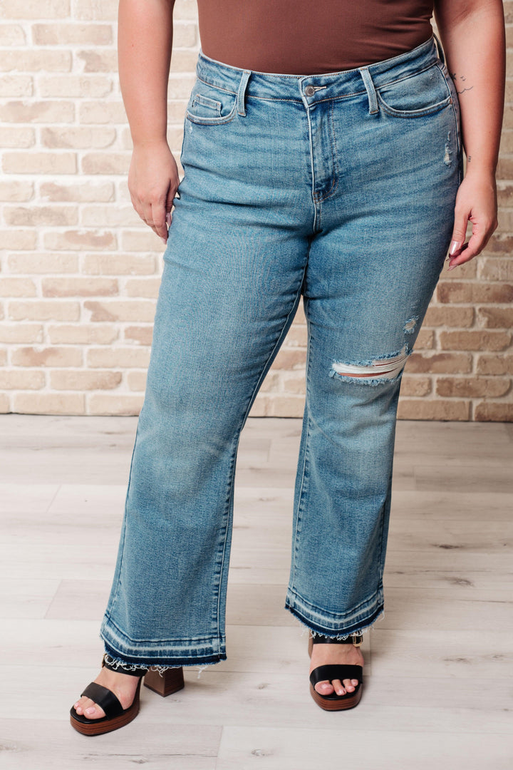 Isla Mid Rise Distressed Released Hem Bootcut Jeans - TheDesignChambersBoutique