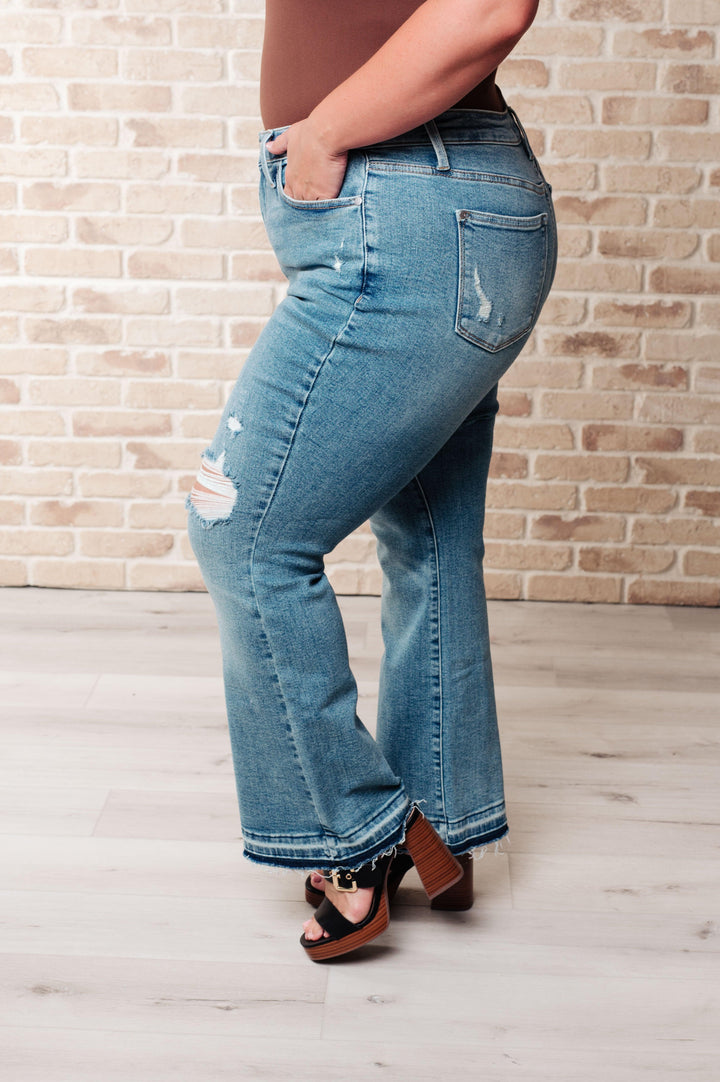 Isla Mid Rise Distressed Released Hem Bootcut Jeans - TheDesignChambersBoutique