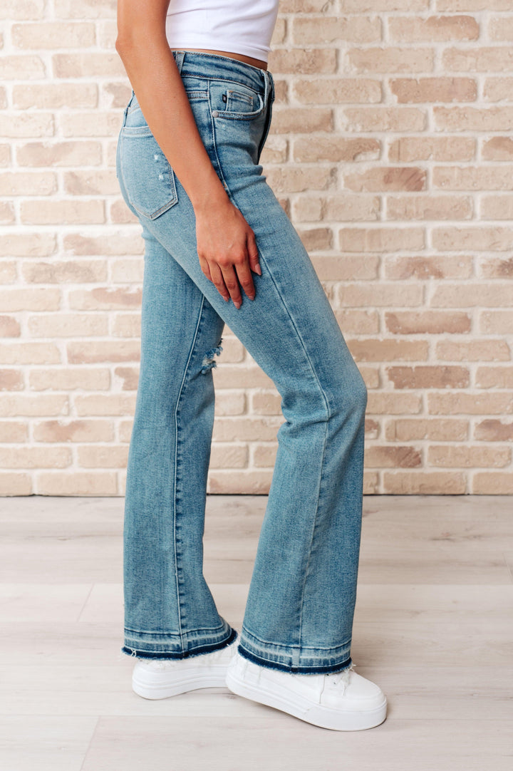 Isla Mid Rise Distressed Released Hem Bootcut Jeans - TheDesignChambersBoutique